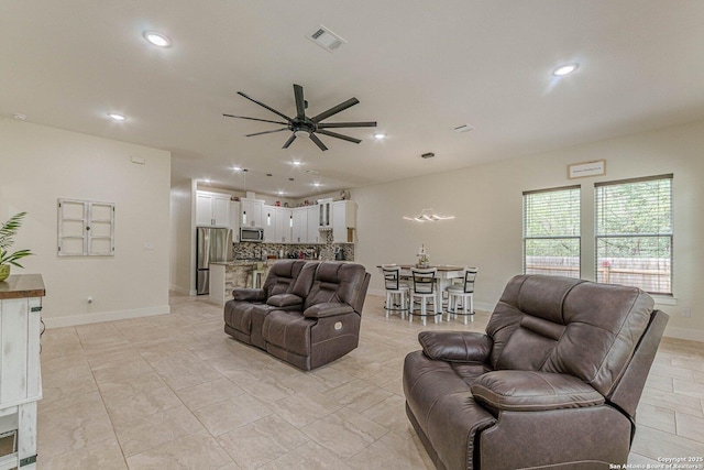 114 Mokukua Ln, Bastrop, TX 78602 - living room with ceiling fan and recessed lighting