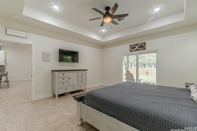 114 Mokukua Ln, Bastrop, TX 78602 - bedroom featuring a tray ceiling, access to exterior, recessed lighting, and ceiling fan
