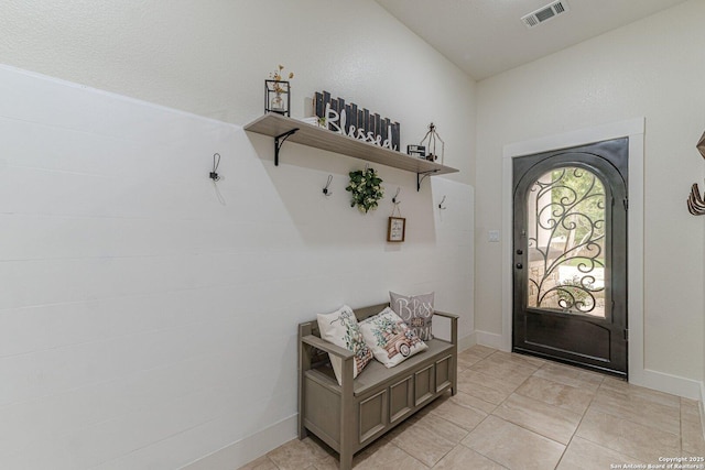 114 Mokukua Ln, Bastrop, TX 78602 - foyer featuring light tile patterned flooring and baseboards