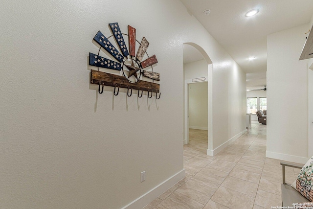 114 Mokukua Ln, Bastrop, TX 78602 - hall featuring arched walkways, recessed lighting, and light tile patterned floors