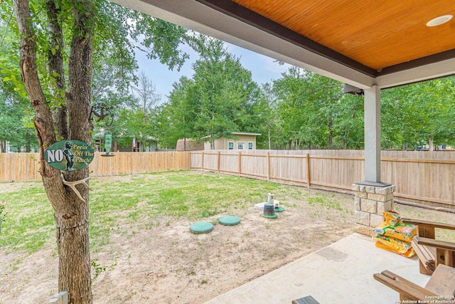 114 Mokukua Ln, Bastrop, TX 78602 - fenced backyard featuring a patio