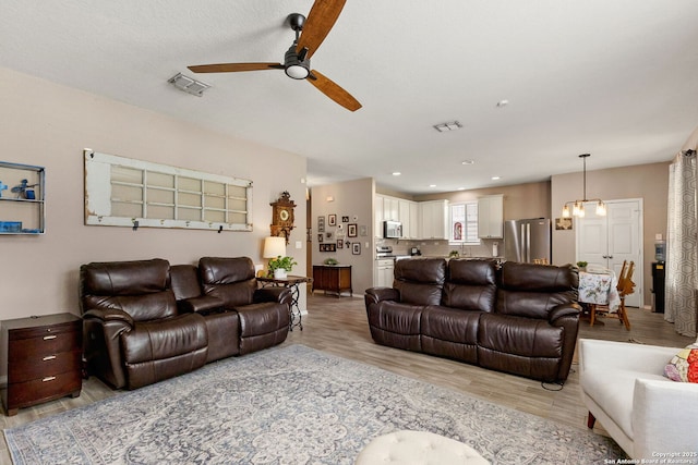 27306 Pollock, San Antonio, TX 78260 - living area featuring a ceiling fan, light wood finished floors, and recessed lighting