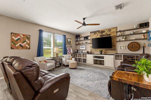 27306 Pollock, San Antonio, TX 78260 - living area with a ceiling fan and light wood-style floors