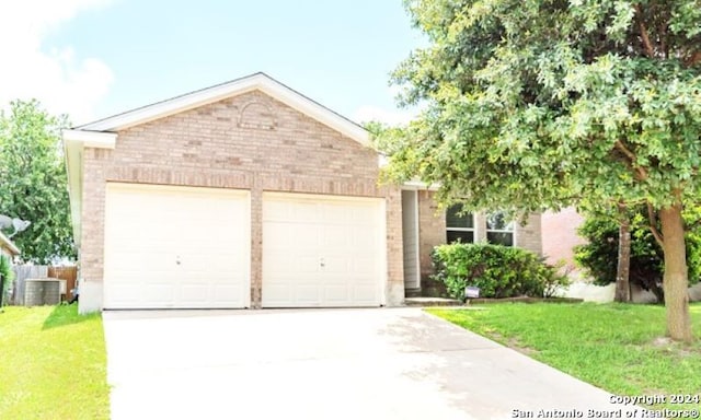 9522 Sage Ter, San Antonio, TX 78251 - view of front of house featuring brick siding, an attached garage, driveway, and a front lawn