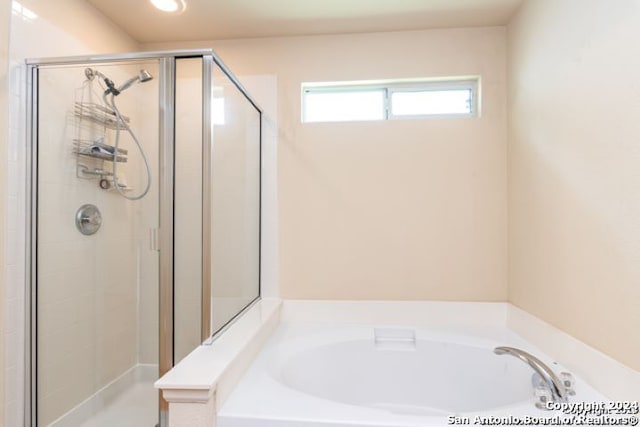9522 Sage Ter, San Antonio, TX 78251 - full bathroom with a shower stall, a bath, and recessed lighting
