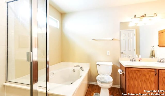 9522 Sage Ter, San Antonio, TX 78251 - full bathroom with vanity, a garden tub, wood finished floors, and a shower with door