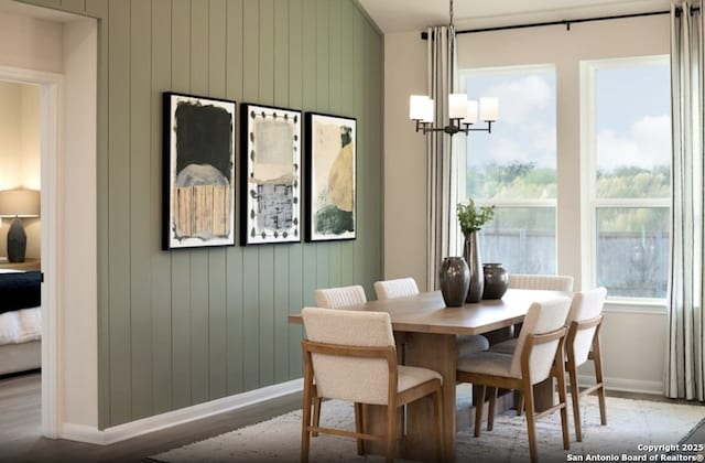 14426 Daphne Bnd, San Antonio, TX 78253 - dining area with a chandelier and wood walls