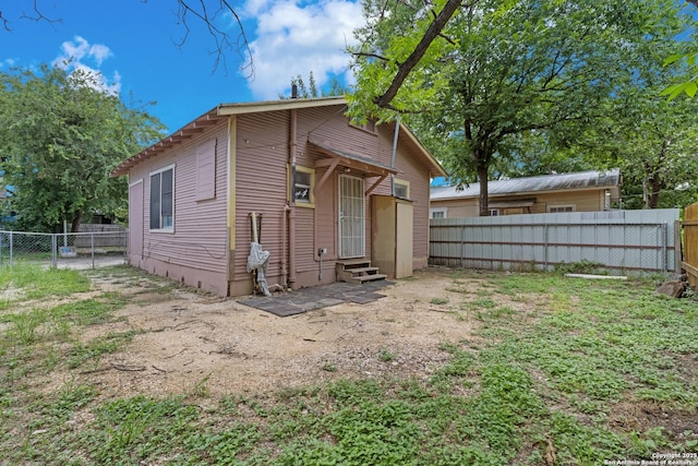 111 English Way, San Antonio, TX 78207 - back of house featuring entry steps and a fenced backyard
