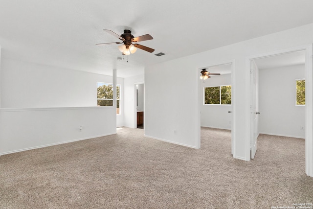 221 Passerina Spur, Schertz, TX 78154 - carpeted spare room featuring ceiling fan and plenty of natural light