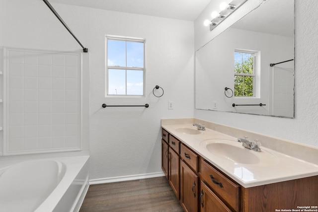 221 Passerina Spur, Schertz, TX 78154 - full bathroom with double vanity, wood finished floors, and tub / shower combination