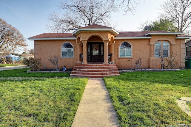 402 Hermine Blvd, San Antonio, TX 78212 - mediterranean / spanish home with stucco siding, a front yard, and roof with shingles