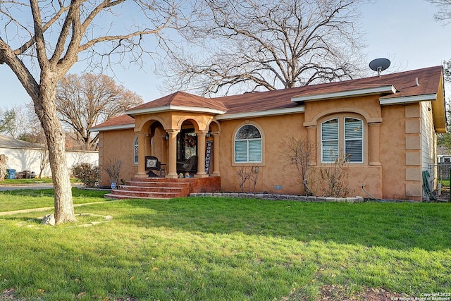 402 Hermine Blvd, San Antonio, TX 78212 - mediterranean / spanish house with stucco siding, a front lawn, and covered porch