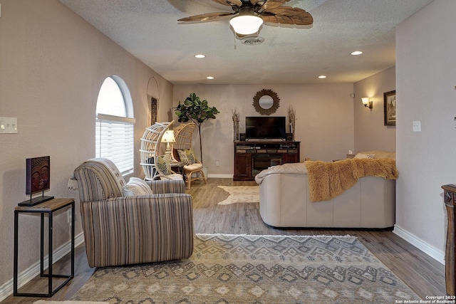 402 Hermine Blvd, San Antonio, TX 78212 - living room featuring ceiling fan, wood finished floors, recessed lighting, and a textured ceiling