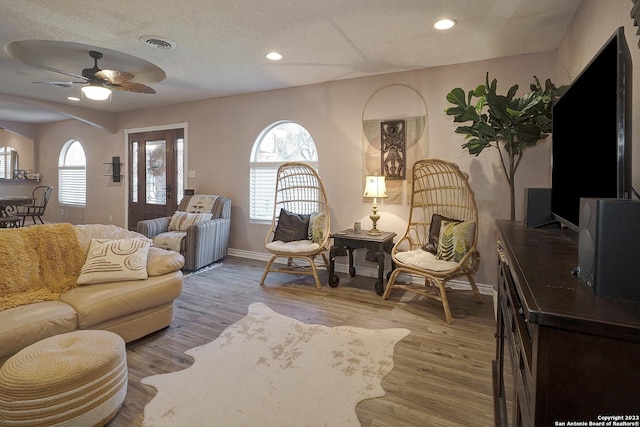 402 Hermine Blvd, San Antonio, TX 78212 - living area with ceiling fan, a textured ceiling, light wood-type flooring, healthy amount of natural light, and recessed lighting
