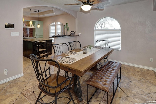 402 Hermine Blvd, San Antonio, TX 78212 - dining space featuring arched walkways, ceiling fan, light tile patterned floors, and recessed lighting