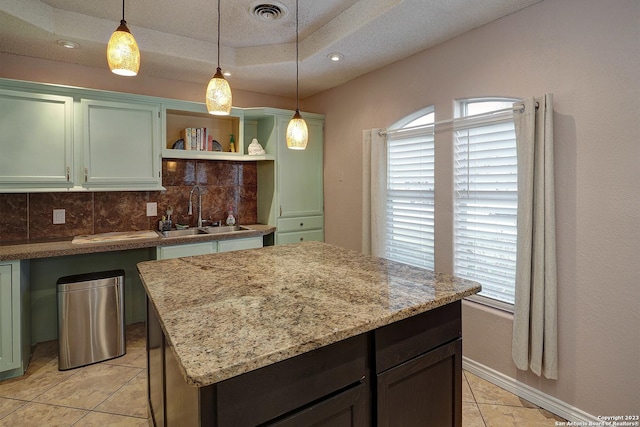 402 Hermine Blvd, San Antonio, TX 78212 - kitchen with open shelves, light tile patterned floors, decorative backsplash, decorative light fixtures, and light stone counters