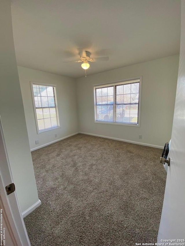 646 N San Eduardo, San Antonio, TX 78228 - unfurnished room with carpet flooring, healthy amount of natural light, and ceiling fan