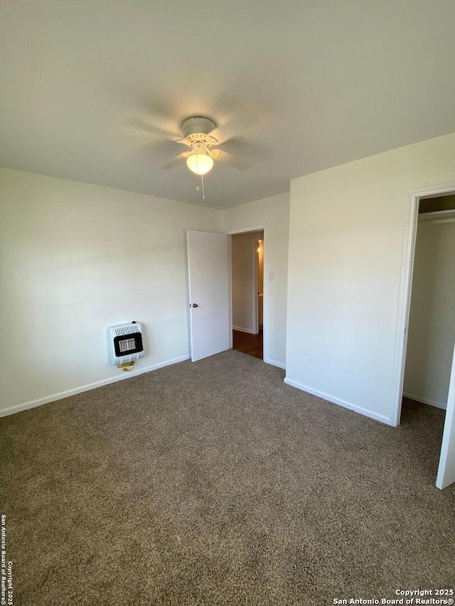646 N San Eduardo, San Antonio, TX 78228 - unfurnished bedroom with heating unit, carpet flooring, and ceiling fan