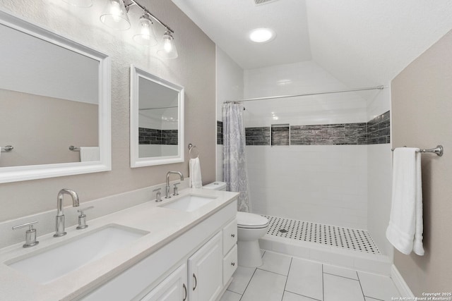 138 E Lullwood Ave, San Antonio, TX 78212 - full bath featuring tile patterned flooring, tiled shower, and double vanity