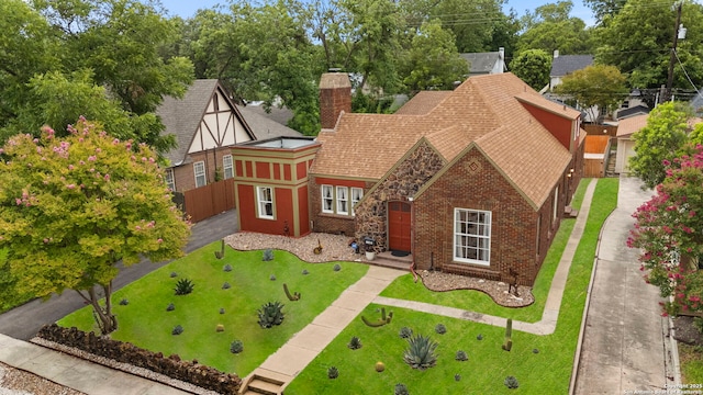 138 E Lullwood Ave, San Antonio, TX 78212 - view of front of home featuring a chimney, brick siding, and roof with shingles