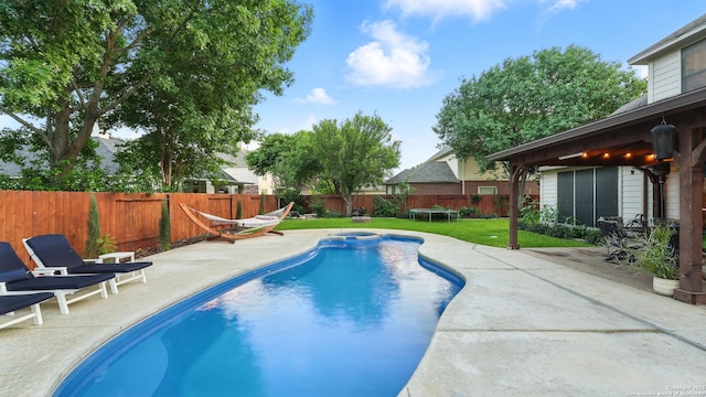 1739 Oak Gln, New Braunfels, TX 78132 - view of swimming pool featuring a patio area, a fenced backyard, and a pool with connected hot tub