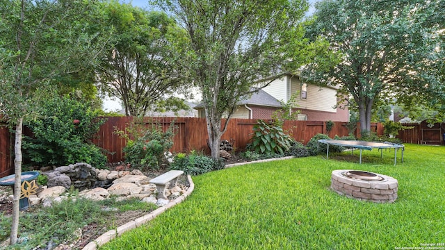 1739 Oak Gln, New Braunfels, TX 78132 - fenced backyard with an outdoor fire pit