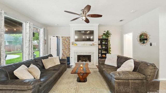 1739 Oak Gln, New Braunfels, TX 78132 - living room with ceiling fan and a fireplace