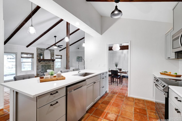2116 Turkey Ledge, San Antonio, TX 78232 - kitchen with stainless steel appliances, a ceiling fan, open floor plan, light countertops, and hanging light fixtures