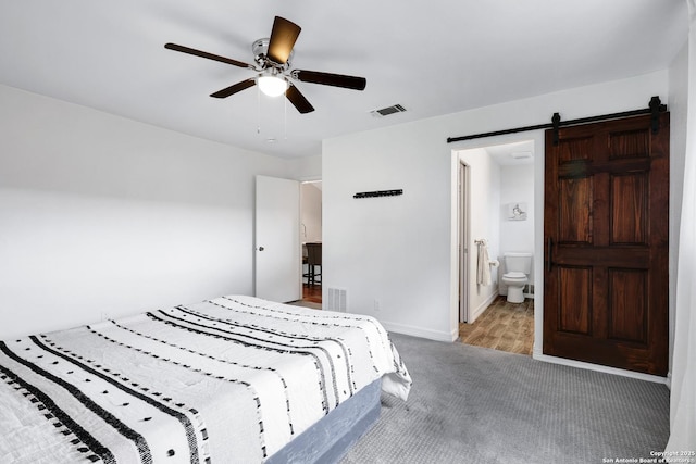 2116 Turkey Ledge, San Antonio, TX 78232 - bedroom featuring carpet flooring, a barn door, a ceiling fan, and ensuite bath