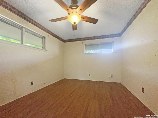 3923 Maxine, San Antonio, TX 78228 - spare room featuring wood finished floors, a textured ceiling, a ceiling fan, and ornamental molding