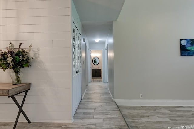 8211 Littleport, San Antonio, TX 78239 - hallway featuring light wood finished floors and baseboards
