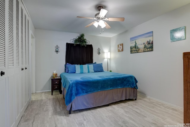 8211 Littleport, San Antonio, TX 78239 - bedroom with light wood finished floors, a closet, and ceiling fan
