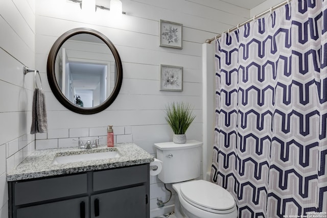8211 Littleport, San Antonio, TX 78239 - bathroom featuring vanity, curtained shower, and wooden walls