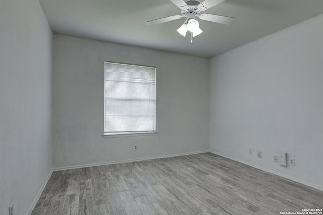 8211 Littleport, San Antonio, TX 78239 - unfurnished room with wood finished floors and ceiling fan