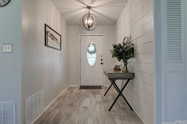 8211 Littleport, San Antonio, TX 78239 - entryway with a chandelier and light wood-style flooring