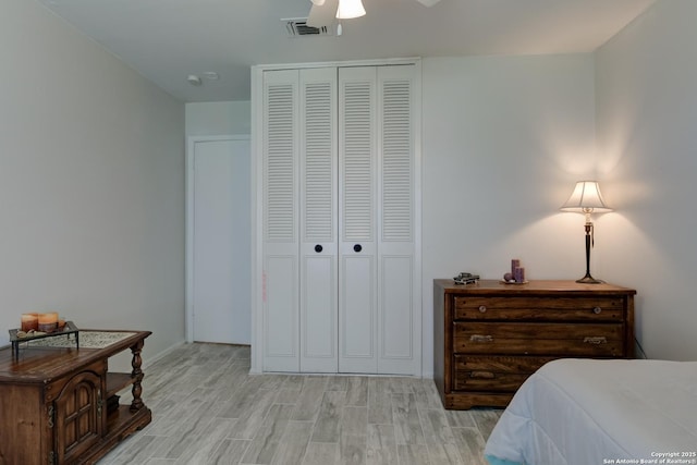 8211 Littleport, San Antonio, TX 78239 - bedroom with light wood-type flooring, a closet, and ceiling fan