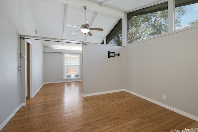 6914 Glen Gate, San Antonio, TX 78239 - empty room featuring a ceiling fan, light wood-style floors, beamed ceiling, and high vaulted ceiling