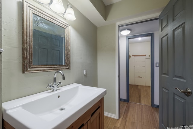 6914 Glen Gate, San Antonio, TX 78239 - bathroom featuring wood finished floors and vanity