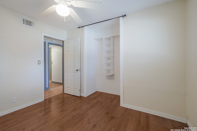 6914 Glen Gate, San Antonio, TX 78239 - unfurnished bedroom featuring wood finished floors and ceiling fan