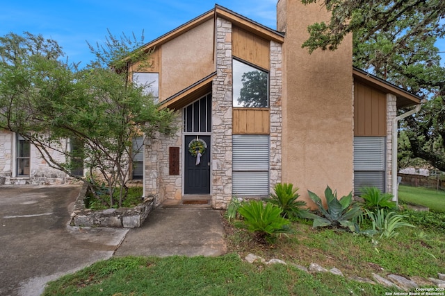 30650 Wildcat Dr, Bulverde, TX 78163 - view of front of home featuring stone siding and stucco siding