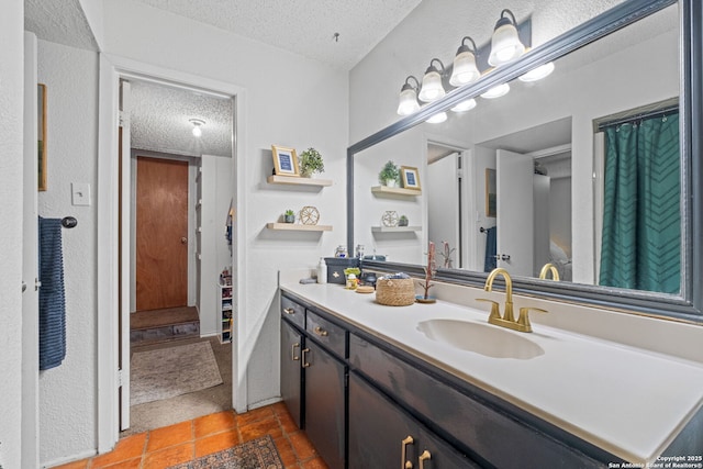 30650 Wildcat Dr, Bulverde, TX 78163 - bathroom with a textured ceiling and vanity