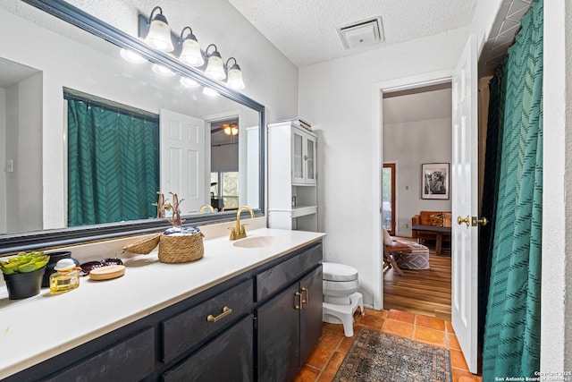 30650 Wildcat Dr, Bulverde, TX 78163 - bathroom with vanity and a textured ceiling