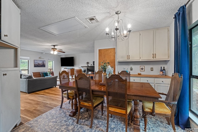 30650 Wildcat Dr, Bulverde, TX 78163 - dining area featuring attic access, a textured ceiling, wood finished floors, and ceiling fan