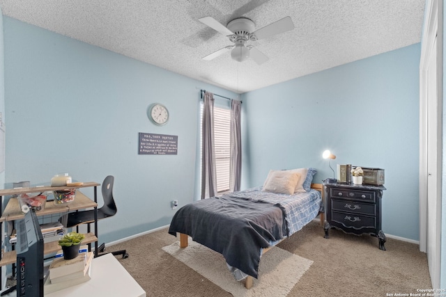 30650 Wildcat Dr, Bulverde, TX 78163 - carpeted bedroom featuring a textured ceiling and ceiling fan
