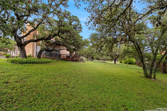 30650 Wildcat Dr, Bulverde, TX 78163 - view of grassy yard with a wooden deck