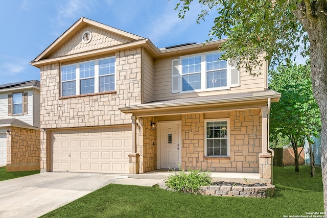 11747 Silver Pr, San Antonio, TX 78254 - view of front of property featuring stone siding, concrete driveway, an attached garage, roof mounted solar panels, and a front yard