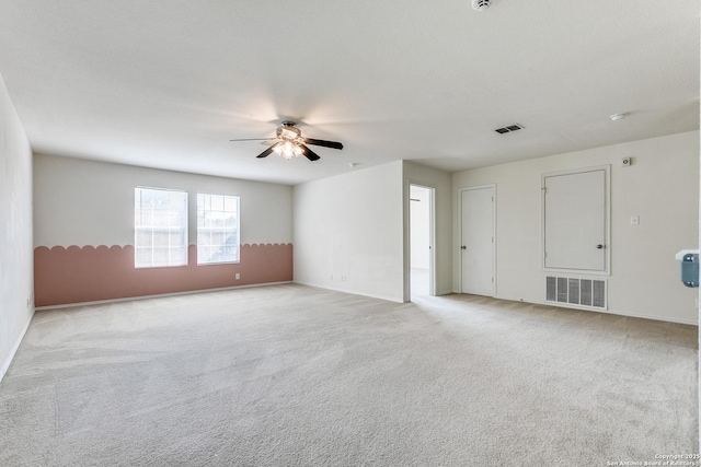11747 Silver Pr, San Antonio, TX 78254 - empty room featuring a ceiling fan, light colored carpet, and a smoke detector