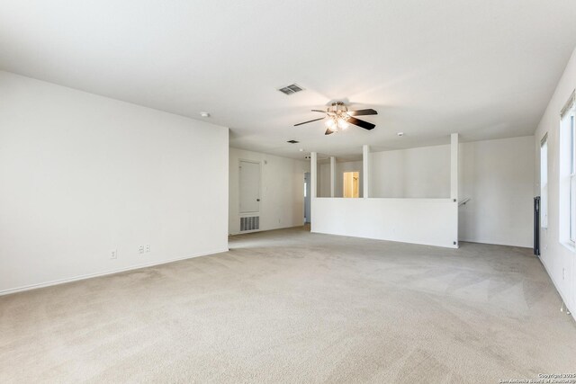 11747 Silver Pr, San Antonio, TX 78254 - unfurnished living room featuring light carpet and ceiling fan