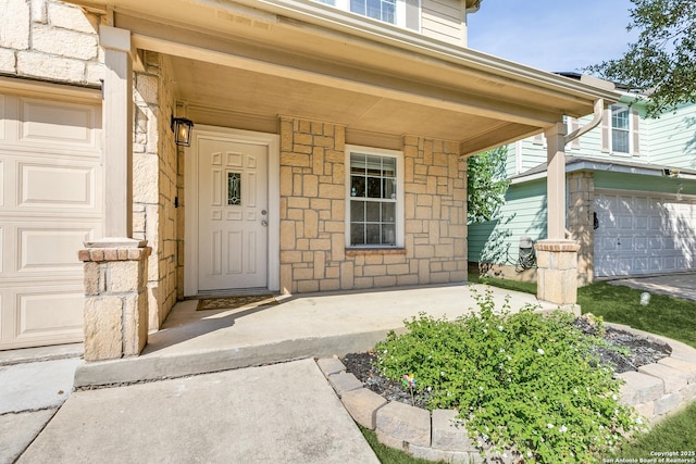11747 Silver Pr, San Antonio, TX 78254 - doorway to property with stone siding, covered porch, and an attached garage