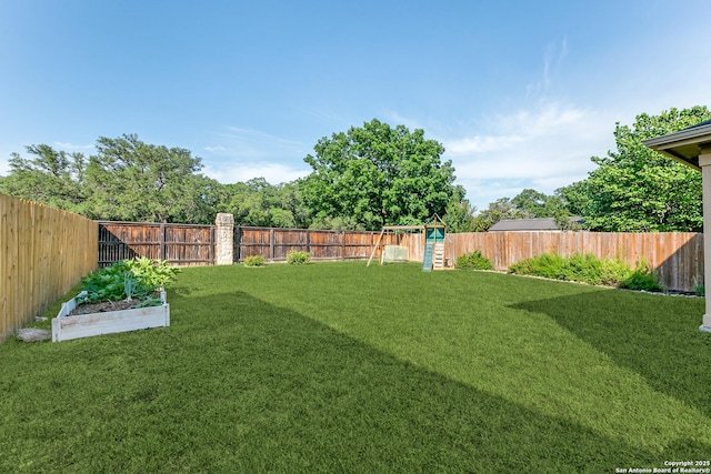 11747 Silver Pr, San Antonio, TX 78254 - fenced backyard with a playground and a vegetable garden